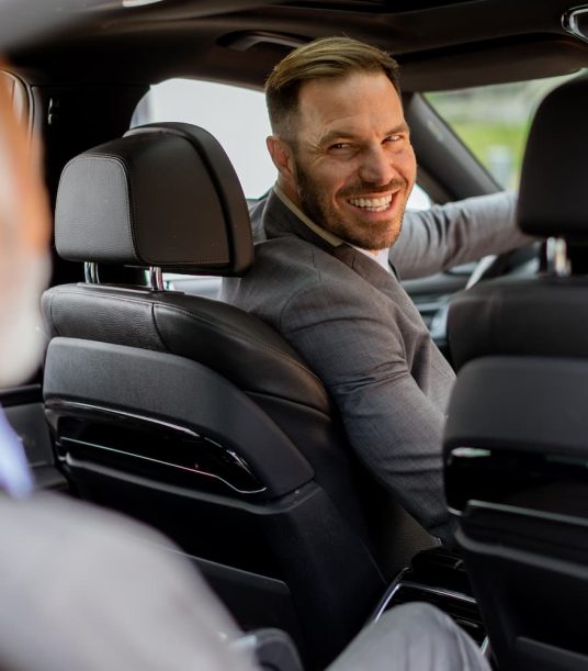 smiling-passenger-engaging-in-friendly-conversatio-2025-02-21-09-05-15-utc-1